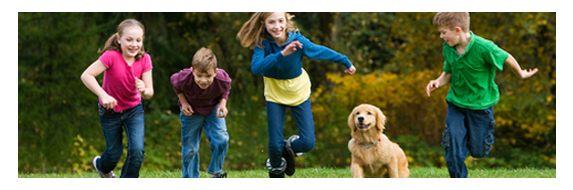 children running with dog